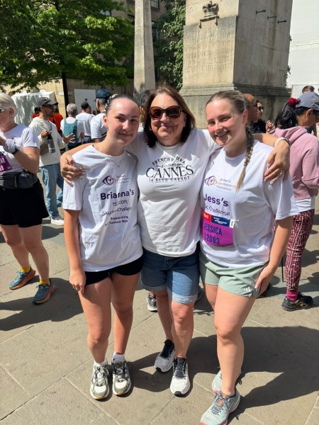 Brianna (left) and her mum Christine (middle), with Brianna's cousin, Jess (right), after finishing the Manchester 10K to further raise money for St Paul's Eye Unit and eye cancer research.
