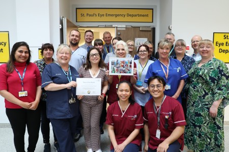 St Pauls Emergency Eye Department collect their July 2025 Team of the Month certificate