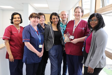 Joanne Bell pictured with her Award for Exceptional Services to TTP Patients from the TTP Network alongside her team including consultant Tina Dutt.JPG