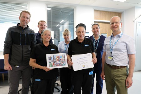 Ward 7A Royal catering team collect their July 2025 Team of the Month certificate