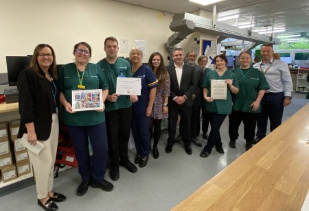 EPMA Upgrade Project team collecting their June 2025 Team of the Month certificate.