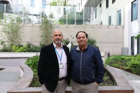 Mr Hemant Sharma and Mr Sanjay Mehra standing in one of the Royal Liverpool University Hospital garden areas.