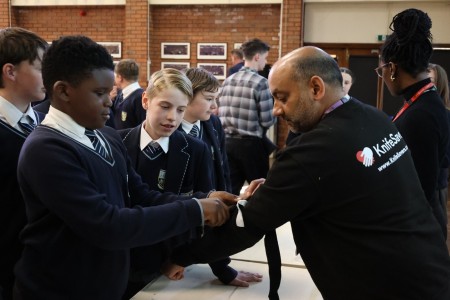 Pupils learning how to apply a tourniquet.JPG