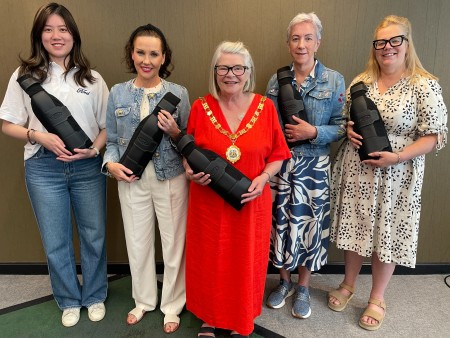 Ann Coffey, Founder of the Sunshine Group, two of its members, Liverpool Lord Mayor, Councillor Barbara Murray and a member of the Ford UK team, all smiling whilst holding Ford's new SupportBelt.